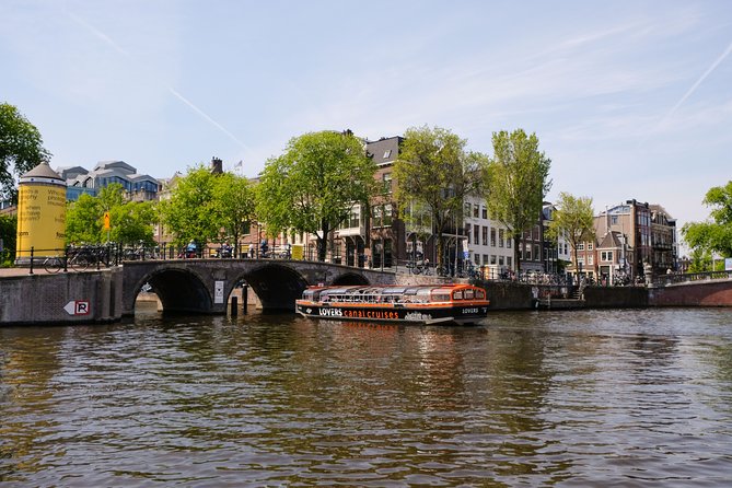 Amsterdam 1h Canal Cruise by Semi-Open Boat with Audio Guide - The Anne Frank House and major museums from the water