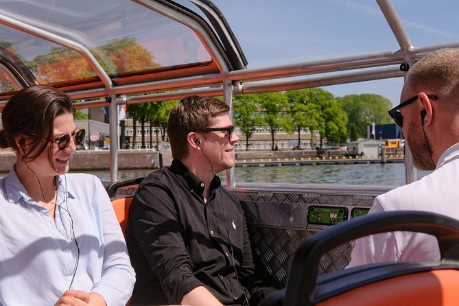 Amsterdam 1h Canal Cruise by Semi-Open Boat with Audio Guide - Audio commentary, crew, and the quality of the ride