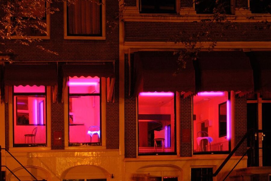 Amsterdam: Red Light District 1-hour Smartphone Audio Tour - Oude Kerk and the district beyond the windows