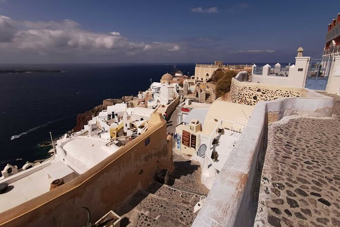 Authentic Santorini: A Self-Guided Audio Tour of Oia - The blue-domed church and picture-postcard Oia
