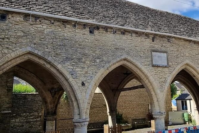 Cirencester’s Tall Tales and Hidden History: A Self-Guided Audio Tour - The abbey gatehouse and Roman town wall