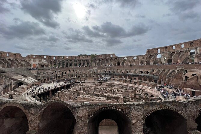 Colosseum Arena with an Audio Guide App - Walking through the Roman Forum