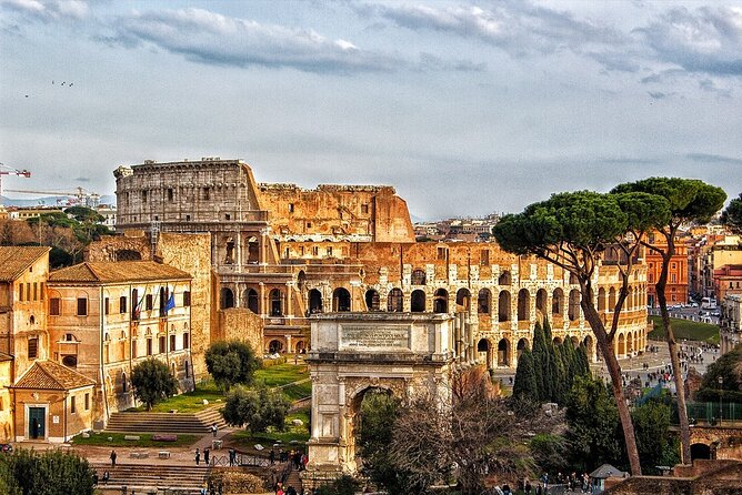 Colosseum, Forum, Palatine Hill with audio guide and Arena or Bus option - Walking through the Roman Forum