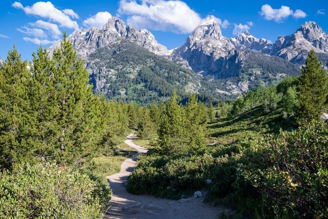 Grand Teton Self-Guided Driving Audio Tour - Jackson Lake Dam connects water and history