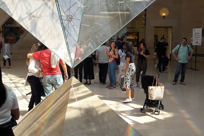 Louvre Museum Timed Entry Ticket with Audio Guide in 4 languages - Entering the Louvre between the Seine and Rue de Rivoli