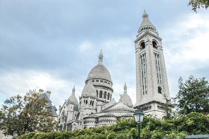 Montmartre: Secret Stories of Paris - Self-Guided Audio Tour - Saint-Pierre, the older church in the basilica’s shadow