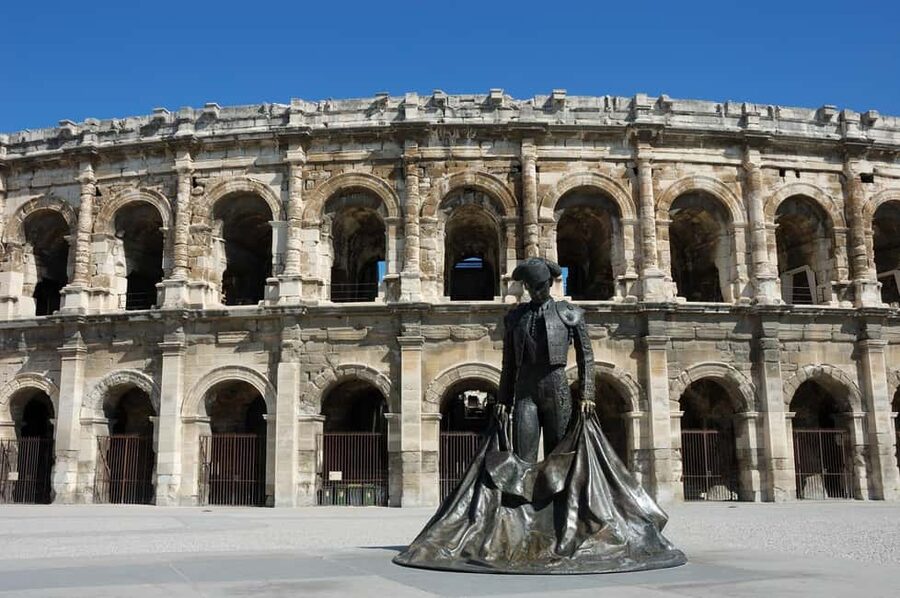 Nimes: Ancient Roman Arena Ticket & Old Town Audio Tour - Entering Nîmes Arena on Boulevard des Arènes