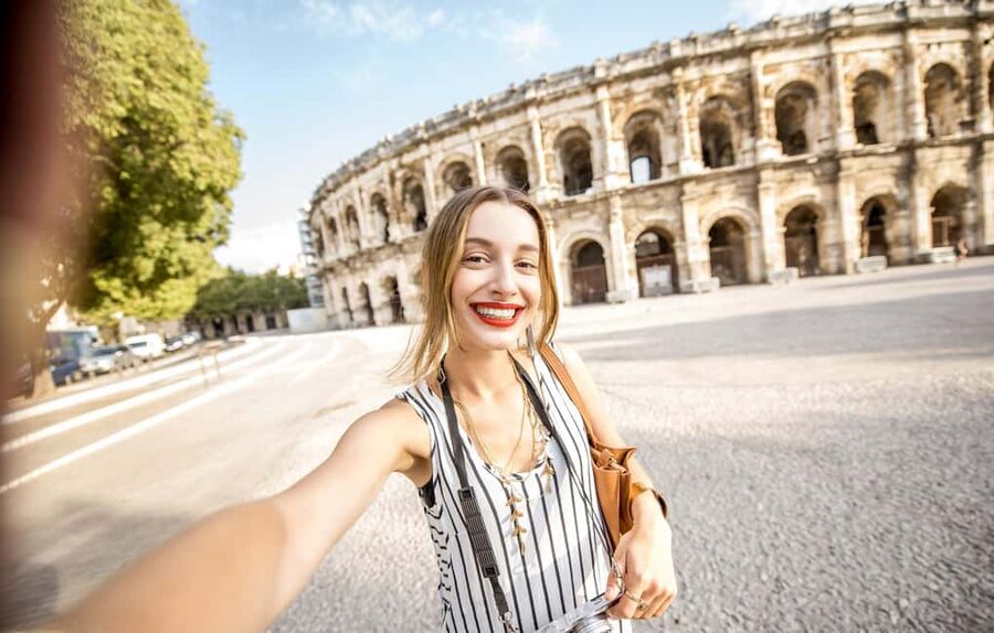 Nimes: Ancient Roman Arena Ticket & Old Town Audio Tour - From gladiator arena to modern concert venue