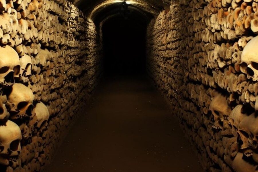 Paris: Catacombs, Audio Guide, and River Cruise Option - Descending 130 steps into the Catacombs