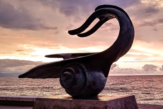 Puerto Vallarta Historical El Centro: A Self-Guided Audio Tour - The Malecon lighthouse and the sculpture route