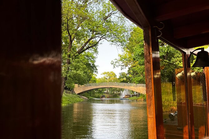 Riga Canal and Daugava Boat Tour with Welcome Drink & Audio Guide - The canal section: a quiet view of central Riga