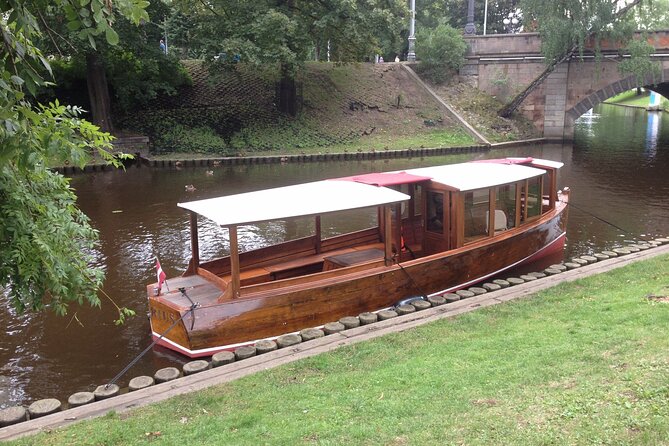 Riga Canal and Daugava Boat Tour with Welcome Drink & Audio Guide - Starting with a welcome drink