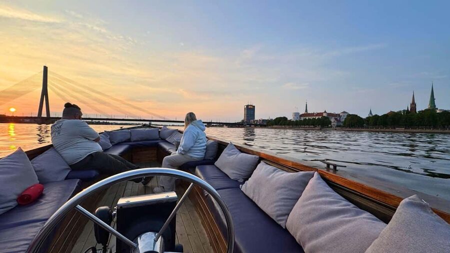 Riga: Canal Boat Tour with Welcome Drink & Audio Guide - Out onto the Daugava and beneath Riga’s bridges