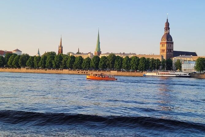 Riga: Evening or Sunset Boat Tour with Drink and Audio Guide - The welcome drink and what it adds