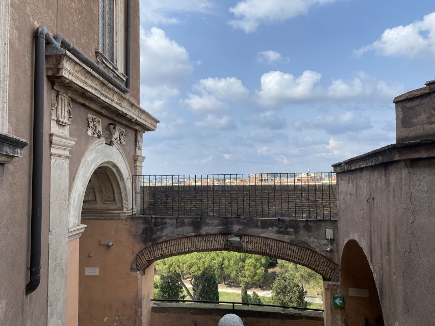 Rome: Castel Sant'Angelo Entry Ticket & Digital Audioguide - Roman foundations, papal rooms, and prison memories