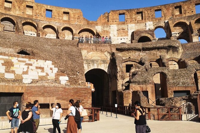 Rome: Colosseum Arena Exclusive Hosted Entrance with Audio Tour - Entering through the Colosseum Arena Gate