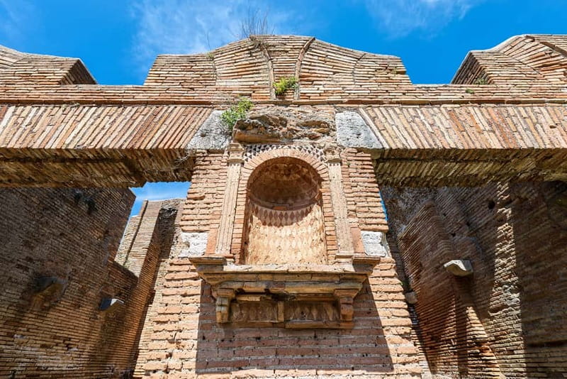 Rome: Ostia Antica Archaeological Park Ticket & Audio App - The theater, bath complex, and theatrical masks