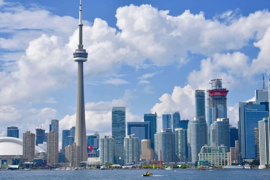 Toronto: True Tales of Toronto Harbour Audio Boat Tour - Toronto Harbour after sunset