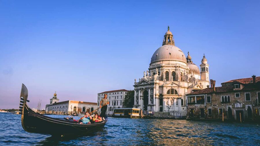 Venice: Gondola Ride under the Bridge of Sighs with Audio Guide App - Boarding a shared gondola for 25 to 30 minutes